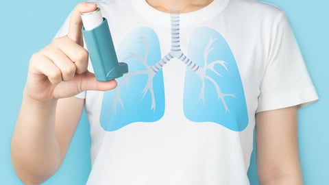 Young woman using blue asthma inhaler for relief asthma attack. Pharmaceutical products is used to prevent and treat wheezing and shortness of breath caused asthma or COPD. Lung organ anatomy.; Shutterstock ID 2040586199