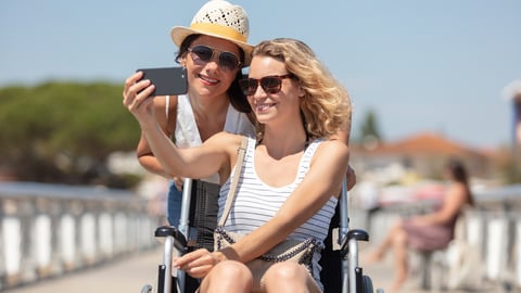 active couple taking selfie with mobile phone on the beach; Shutterstock ID 2156796541