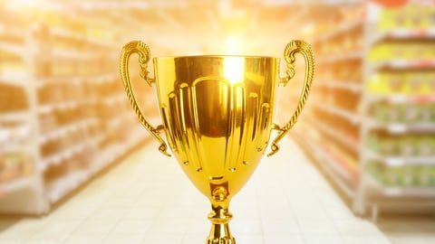 supermarket award, grocery trophy, gold prize for the best store, cup on the background of a hypermarket; Shutterstock ID 2180615443