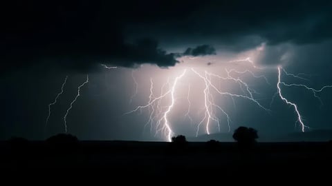 Powerful lightning flash illuminates the night sky during a thunderstorm, shallow depth of field,; Shutterstock ID 2293942911