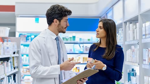 Pharmacy, medicine and pharmacist talking to customer while working in a retail store. Professional man in pharmaceutical or medical industry for service, healthcare and advice for a woman client; Shutterstock ID 2315198817