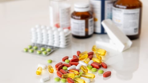 Medicine pills, drugs in different colours arranged on a white background. Human health care medical concept.; Shutterstock ID 2432099501
