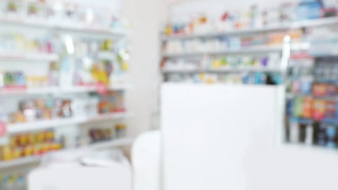 Pharmacy interior with different pharmaceuticals, blurred view; Shutterstock ID 2441037875