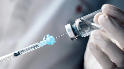 injecting injection vaccine vaccination medicine into a syringe woman nurse; Shutterstock ID 2452807617