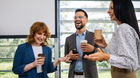Group of multicultural colleagues standing in the conference room and having coffee break.; Shutterstock ID 2495852169