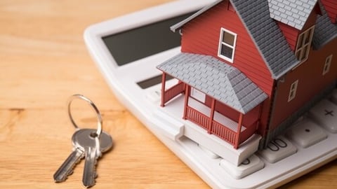 Red house model on white calculator and house key on wooden table background. Homebuyers, mortgage loan, banking, real estate investment trust (REIT), reverse mortgage, home selling or rental concept.; Shutterstock ID 2673029223