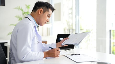 professional doctor wearing uniform taking notes in journal, physician therapist practitioner filling medical documents, clipboard, patient form, illness history, prescription.; Shutterstock ID 2673196095
