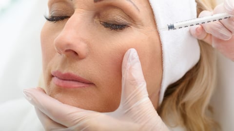 Senior lady having botox injecting procedure; Shutterstock ID 499981222