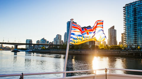 The beautiful British Columbia flag in front of downtown Vancouver at sunset. ; Shutterstock ID 507691354