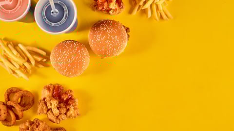 Fast food dish on yellow background. Fast food set fried chicken, meat burger and french fries. Take away fast food.; Shutterstock ID 749423806
