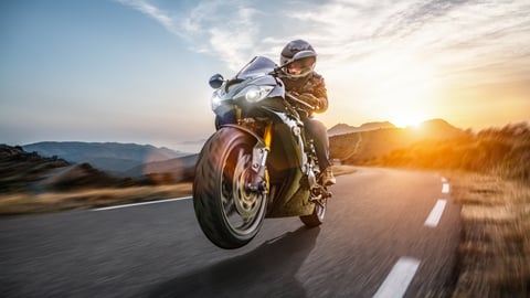 Motorcycle rider at sunset