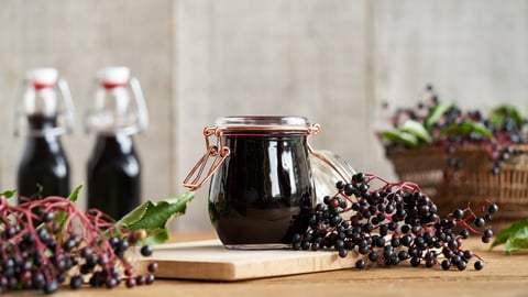 jars of elderberry juice and berries