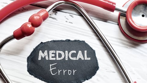 red-stethoscope-with-words-medical-error