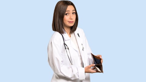 young female doctor holding empty wallet