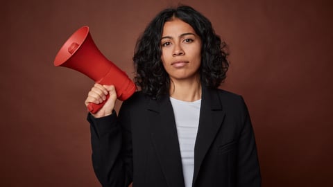 Black woman holding a red megaphone