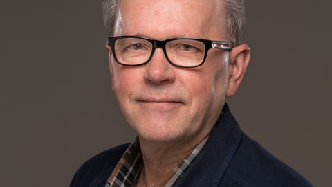 Headshot of man: Dr. John Maxted