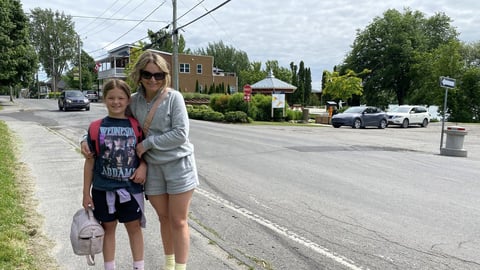 Les Cedres resident Amelie Rhéaume poses for a photo in Les Cedres, Que., on Wednesday, June 12, 2024. On June 6, the municipality of Les Cèdres, in the Monteregie region of Quebec, published a press release, reminding residents that children can play in certified free play zones on residential streets as long as they acquire the signatures of at least two-thirds of households on the street where they want to play. Rhéaume says the bylaw is of little use and won't be respected. THE CANADIAN PRESS/Joe Bongio