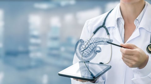 anonymous doctor points to holographic display of pancreas, used in diabetes education