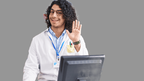 A hispanic man pharmacist waving