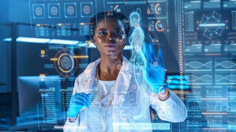 Young Black woman doctor using advanced technology