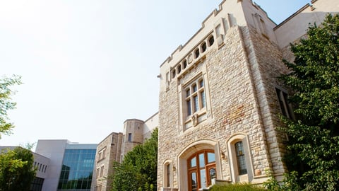 University of Saskatchewan cream-coloured 1948 stone building in Saskatoon in the summertime.