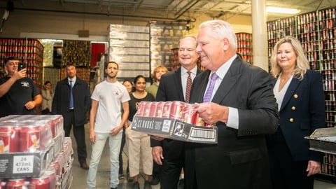 Ontario Premier Doug Ford visits a brewery and picks up a pack of beer. (Premier of Ontario Photography)