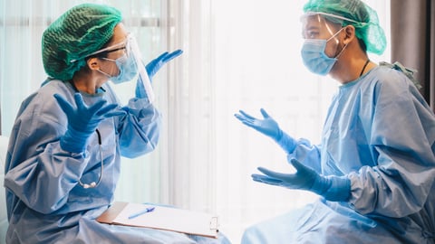 A doctor and a nurse are seen arguing in a hopsital.