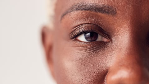 Close up of older Black woman highlighting her eye