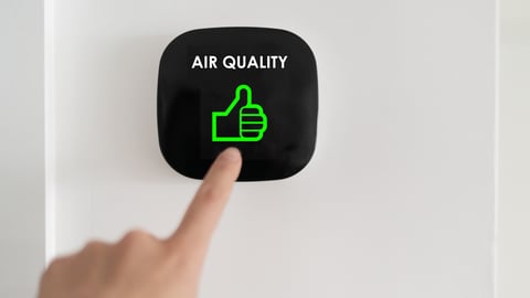 Good air quality indoor smart home domotic touchscreen system. air. Woman touching touchscreen checking air purifier filter at green level with thumbs up graphics.; Shutterstock ID 1958165653