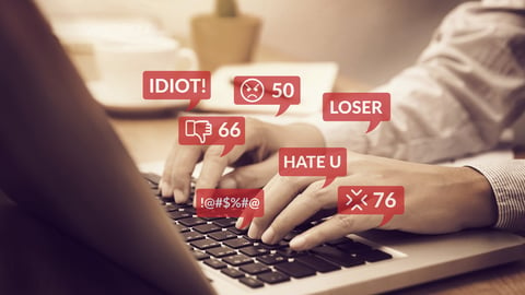 cyber bullying concept. people using notebook computer laptop for social media interactions with notification icons of hate speech and mean comment in social network; Shutterstock ID 1488795377