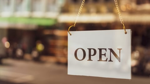 A business sign that says ‘Open’ on cafe or restaurant hang on door at entrance. Vintage color tone style.; Shutterstock ID 1443200282