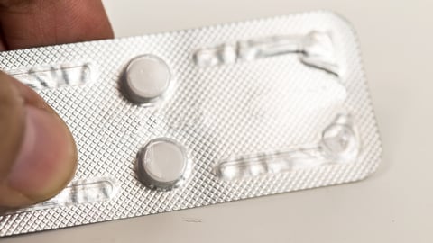 contraceptive pill ,or morning after pill on woman hand,abortion concept.; Shutterstock ID 408826882