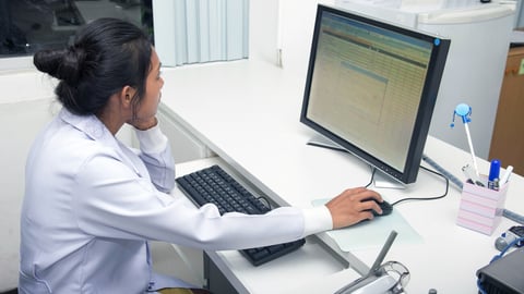 Woman doctor working on computer in office of hospital. Medical staff looking at monitor.; Shutterstock ID 254365621