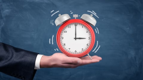 A male hand holds palm up a large red alarm clock with white sound wave lines on blue background. Last time for everything. Final deadline. Wake up call.; Shutterstock ID 722119345