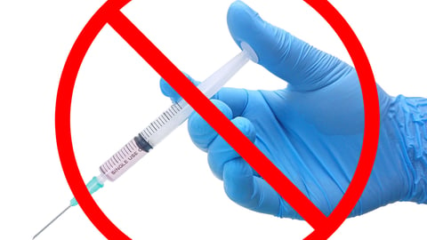 No vaccination sign, vaccines products in syringe instrument on the hand of doctor in blue medical glove isolated on white background, Anti-vaxxers concept; Shutterstock ID 1446799619