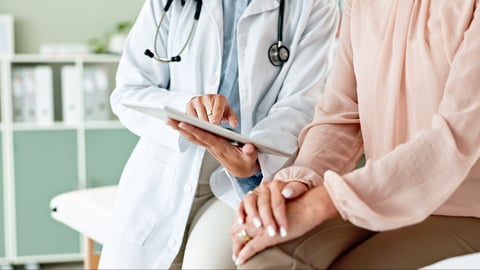 Clinic, tablet and hands of doctor with patient for consulting, medical service and help in hospital. Healthcare, telehealth and people on digital tech for diagnosis, online results and insurance; Shutterstock ID 2472677039