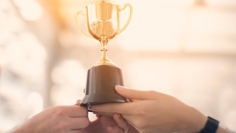 Professional business teamwork holding trophy cup celebrating with trophy award for successful in business ,achievement and businessman concept.; Shutterstock ID 1021053790