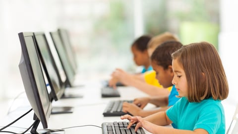 group elementary school students in computer class; Shutterstock ID 147597611