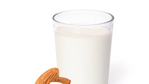 Glass of Almond milk and almond seeds isolated on white background. Healthy drinks concept.; Shutterstock ID 1688473309