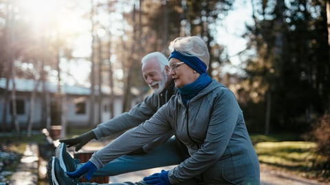 An older married couple enjoys exercising and jogging on a beautiful sunny winter day.; Shutterstock ID 2115110792