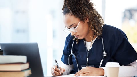 Medical student, thinking or writing books in research education, wellness studying or hospital learning. Laptop, nurse or healthcare woman and notebook, technology or scholarship medicine internship; Shutterstock ID 2260732105