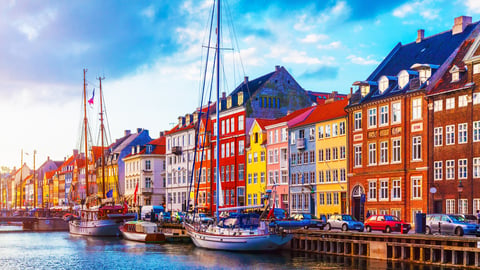 Scenic summer sunset view of Nyhavn pier with color buildings, ships, yachts and other boats in the Old Town of Copenhagen, Denmark; Shutterstock ID 787660261