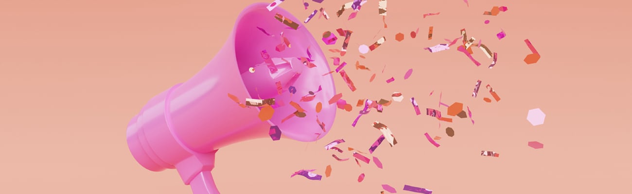 A pink megaphone with confetti flying out