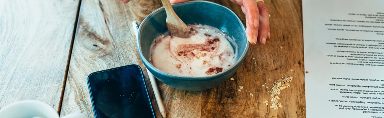 Close up of a woman's hands as she mixes a homemade lotion