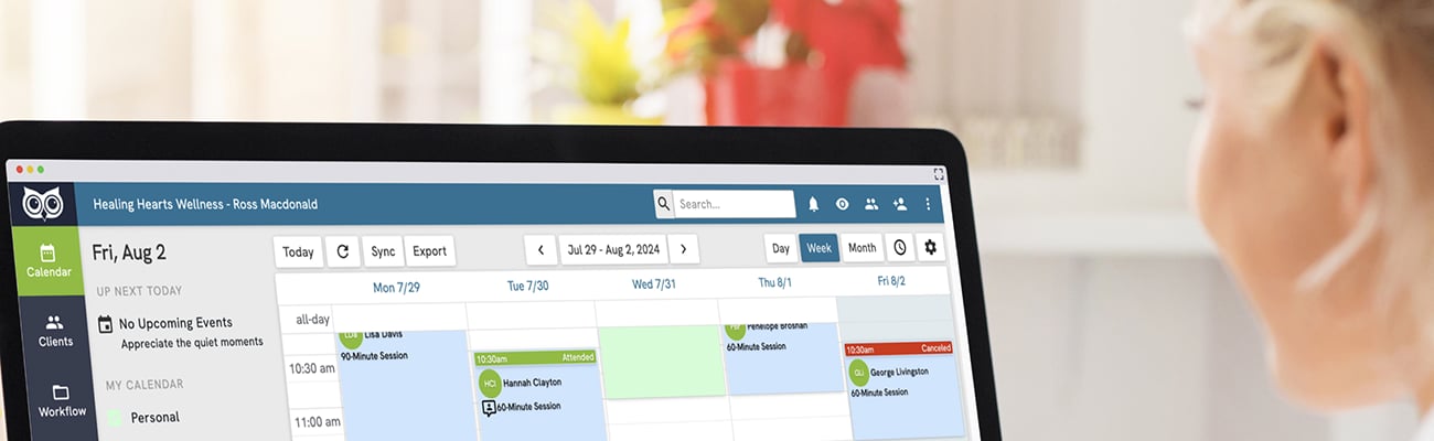 Person viewing a digital schedule on desktop monitor.