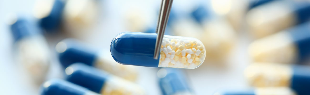 Blue and white capsule pills