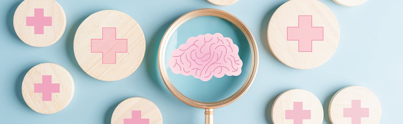 A magnifying glass roving over options and zeroing in on a picture of a brain