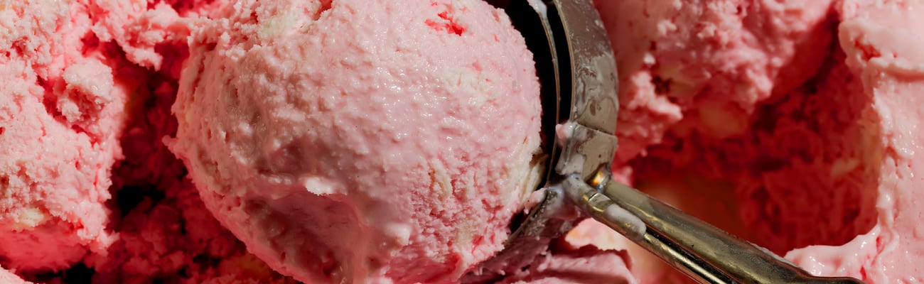 Old timey ice cream scooper with strawberry ice cream
