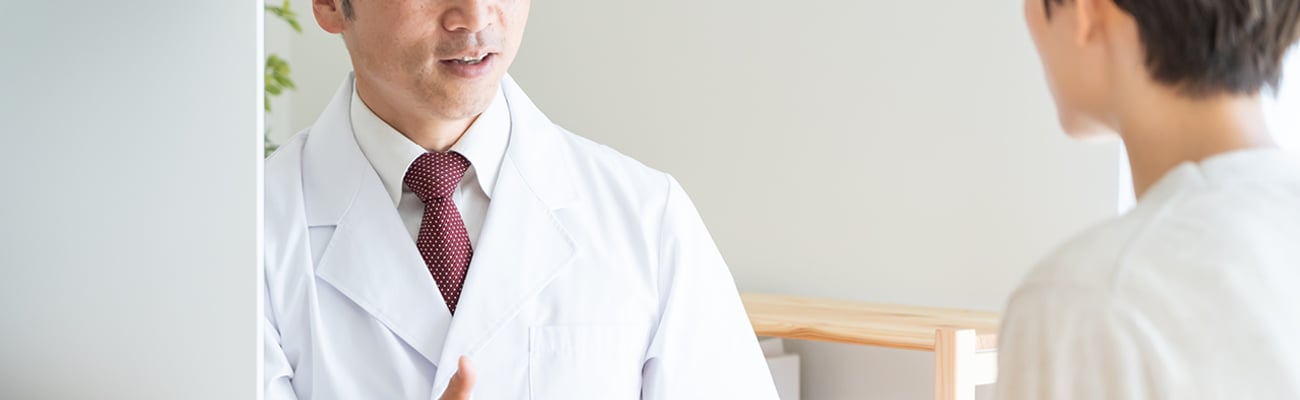 A pharmacist chatting with a patient