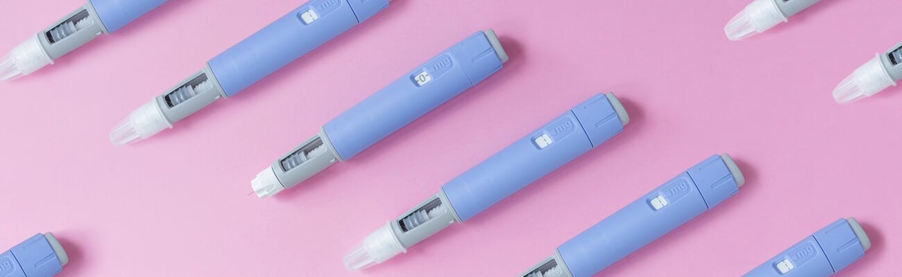 medical drug Ozempic injection lies on a pink background, top view. Medicine and weight loss, concept. injectors dosing pens for subcutaneous injection of antidiabetic medication or anti-obesity; Shutterstock ID 2500958309